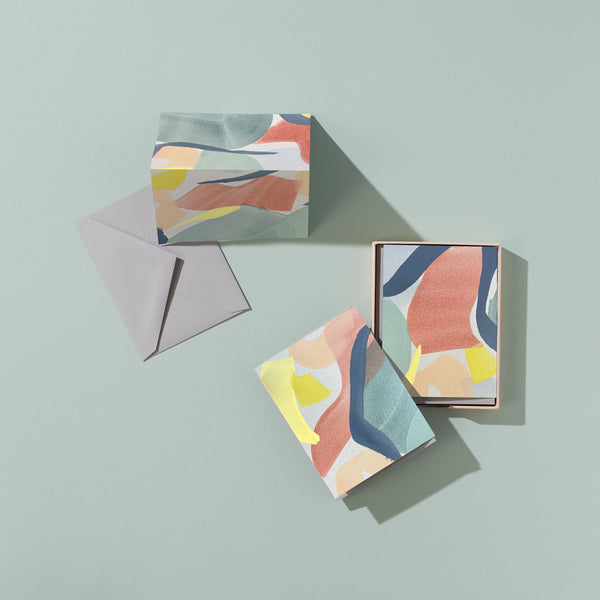 Moglea Skye Stationery Set with colorful notebooks, pens, and paper in a coordinated design arranged on a flat surface.